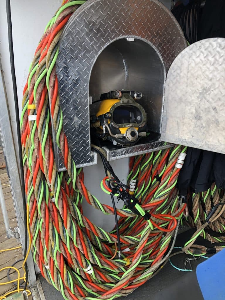 Helmet and umbilical cord used in commercial diving.